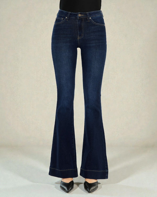 Blue flared jeans on a plain background