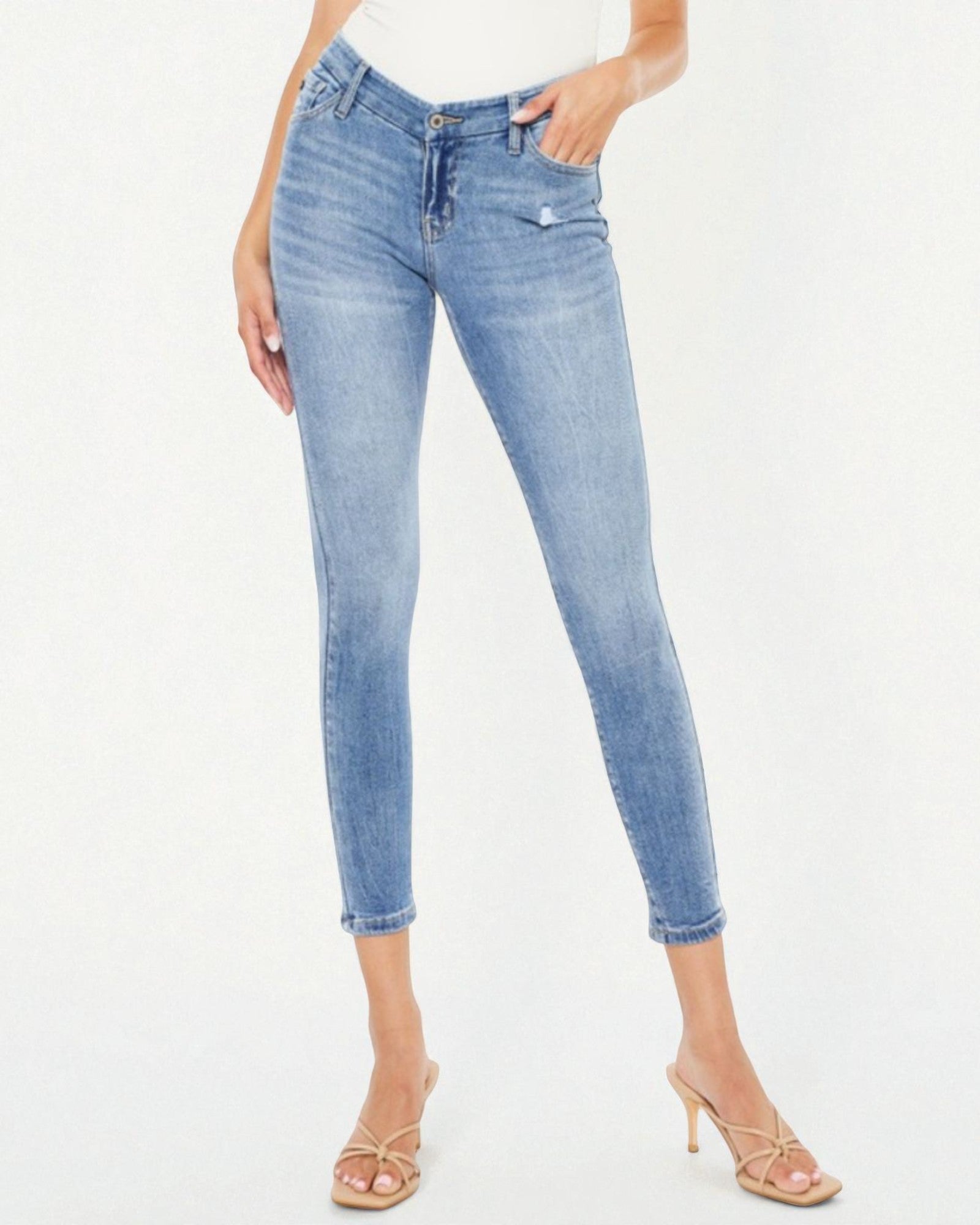 Light blue jeans worn by a person on a white background