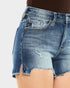 Close-up of a denim skirt with a plain background