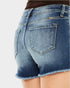 Blue denim shorts on a white background