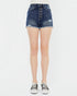 Denim shorts worn by a person on a white background