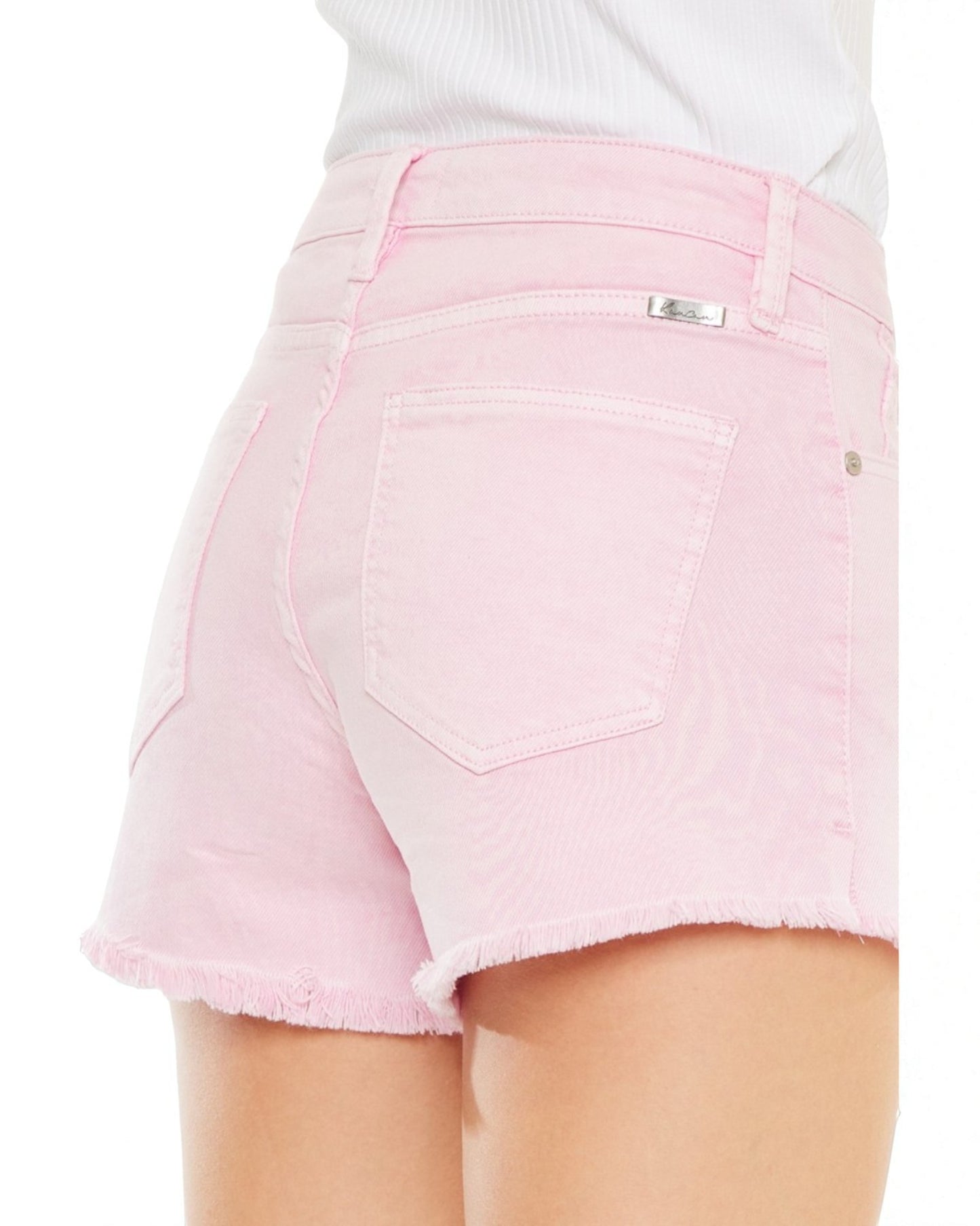 Pink denim shorts on a white background