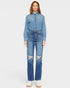 Person wearing a denim outfit with a white background