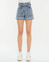 Denim shorts worn by a person on a white background