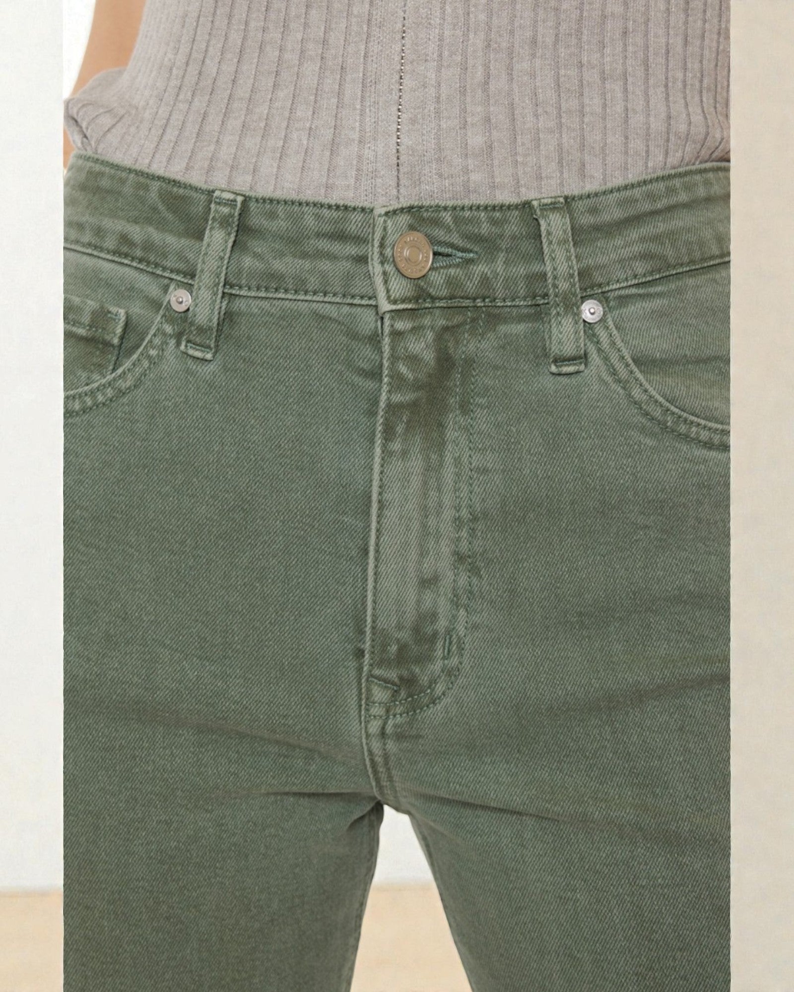 Green pants with a beige background