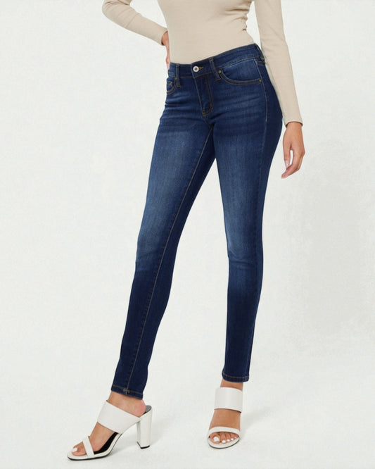 Blue jeans worn by a person on a white background