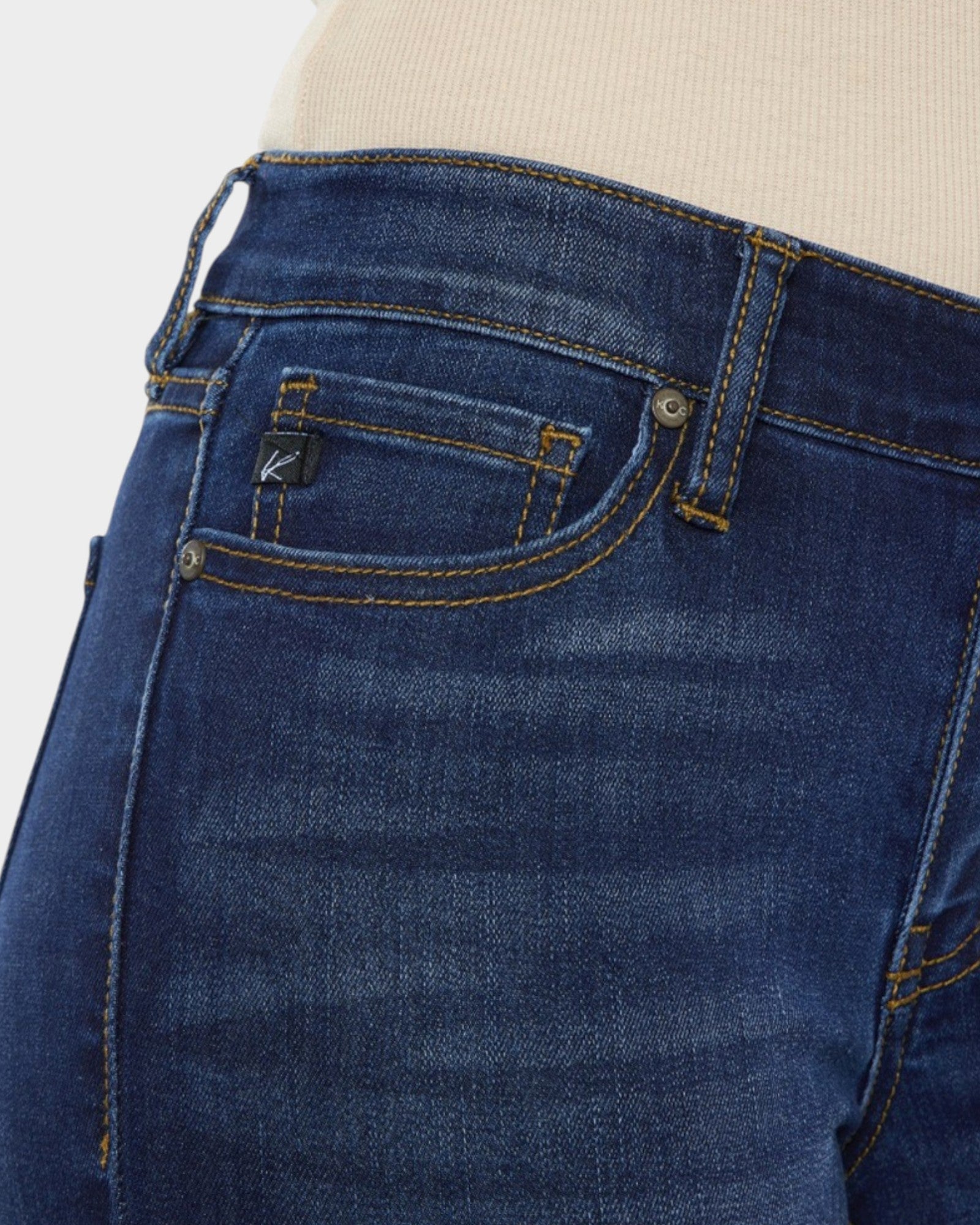 Close-up of blue jeans with a neutral background