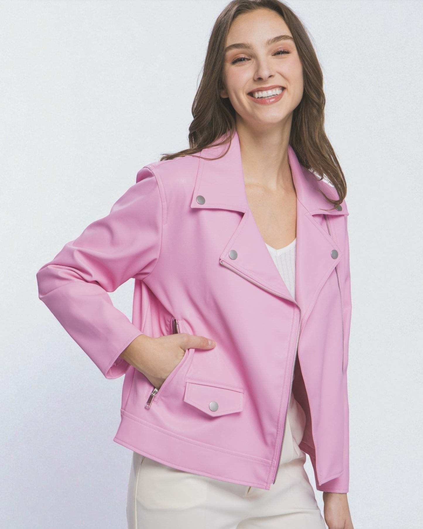 Woman wearing a pink jacket on a white background