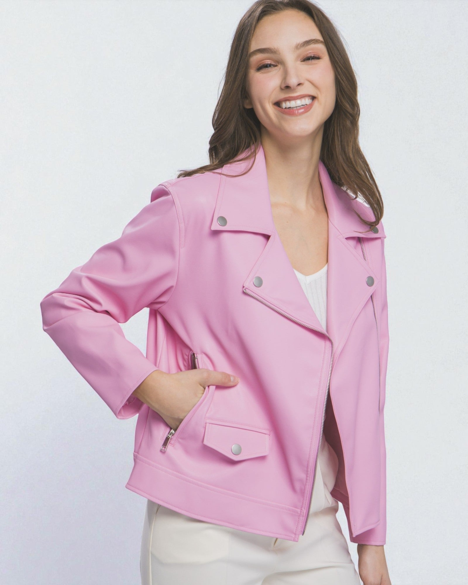Woman wearing a pink jacket on a white background
