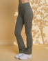 Person wearing olive green pants with a neutral background