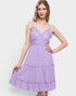 Woman wearing a purple dress on a white background