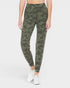 Camouflage leggings worn by a person on a white background