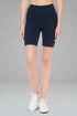 Person wearing navy blue shorts on a gray background