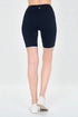 Person wearing black high-waisted shorts on a white background