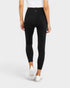 Person wearing black leggings on a white background