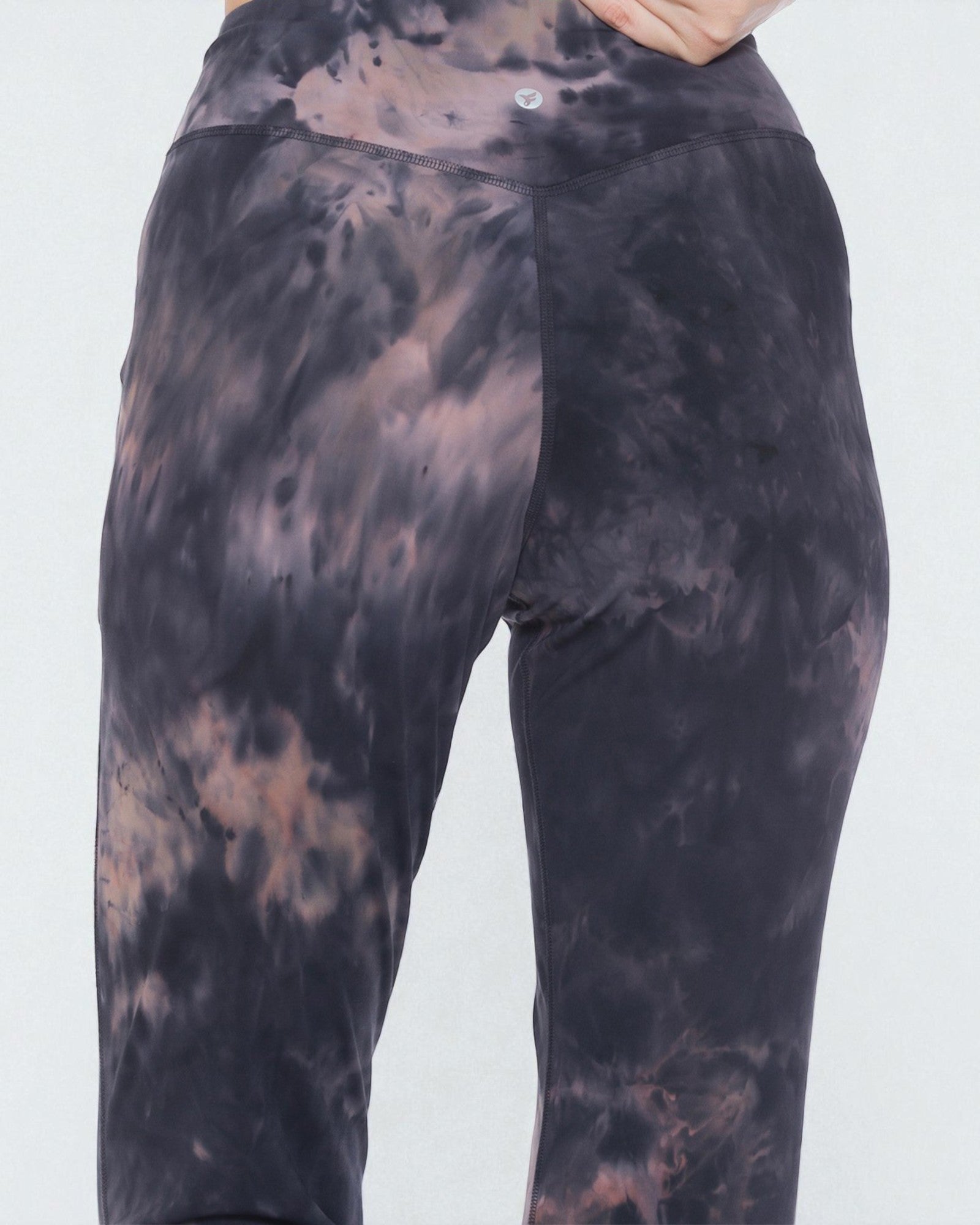 Tie-dye pants with black and brown patterns on a white background