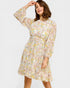 Woman wearing a floral dress on a white background