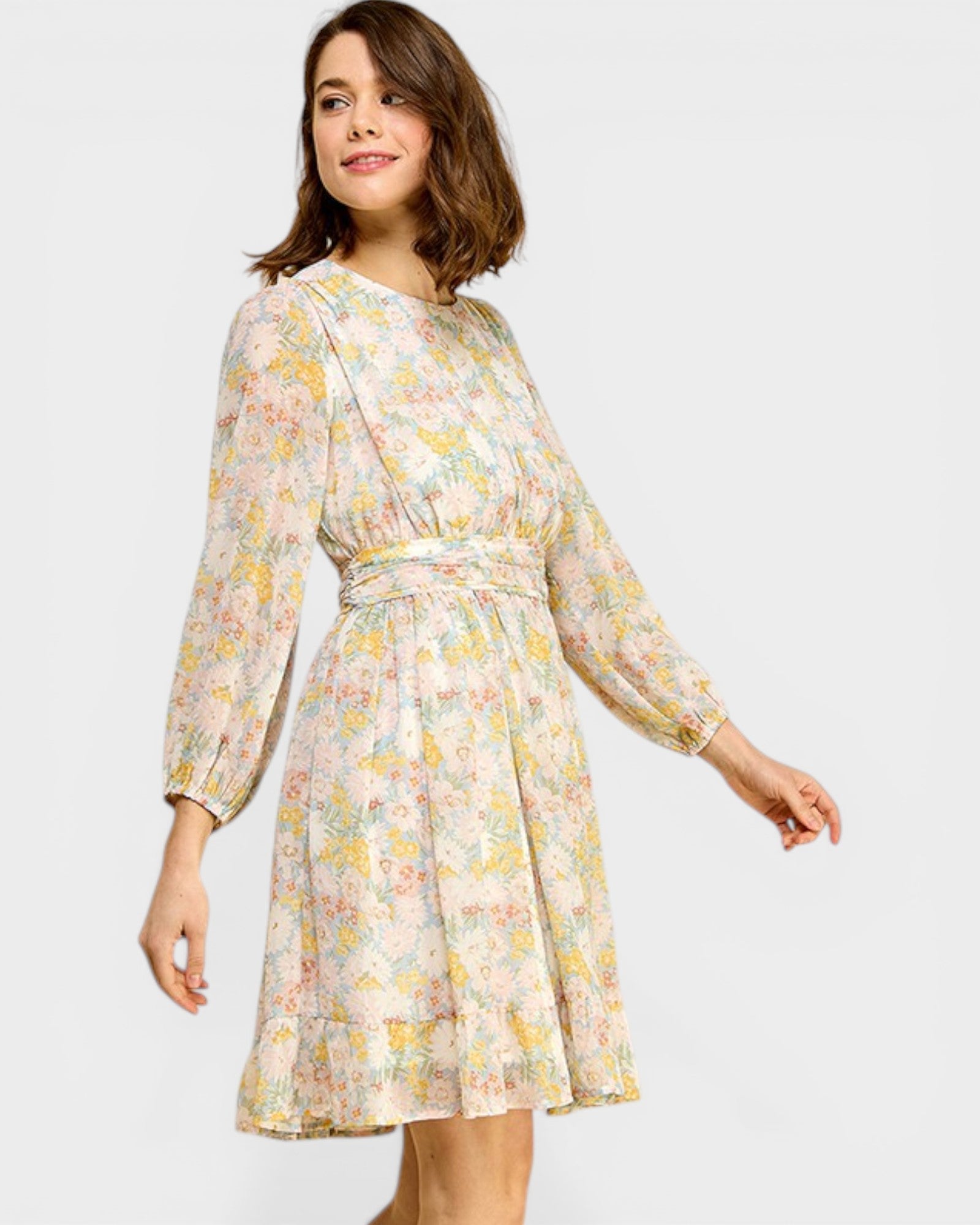 Woman wearing a floral dress on a white background