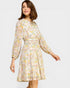 Woman wearing a floral dress on a white background