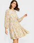 Woman wearing a floral dress on a white background