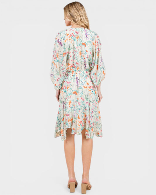 Woman wearing a floral dress on a white background