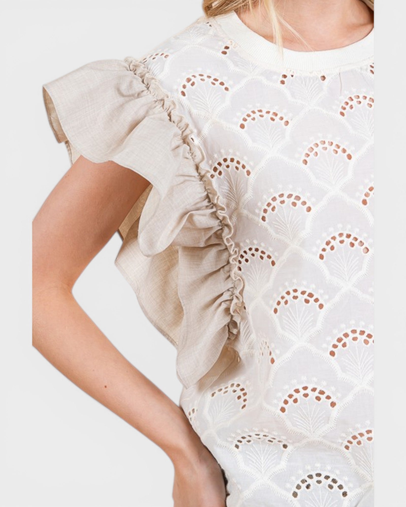White dress with ruffled sleeves on a white background