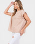 Woman wearing a beige striped top and white pants on a white background