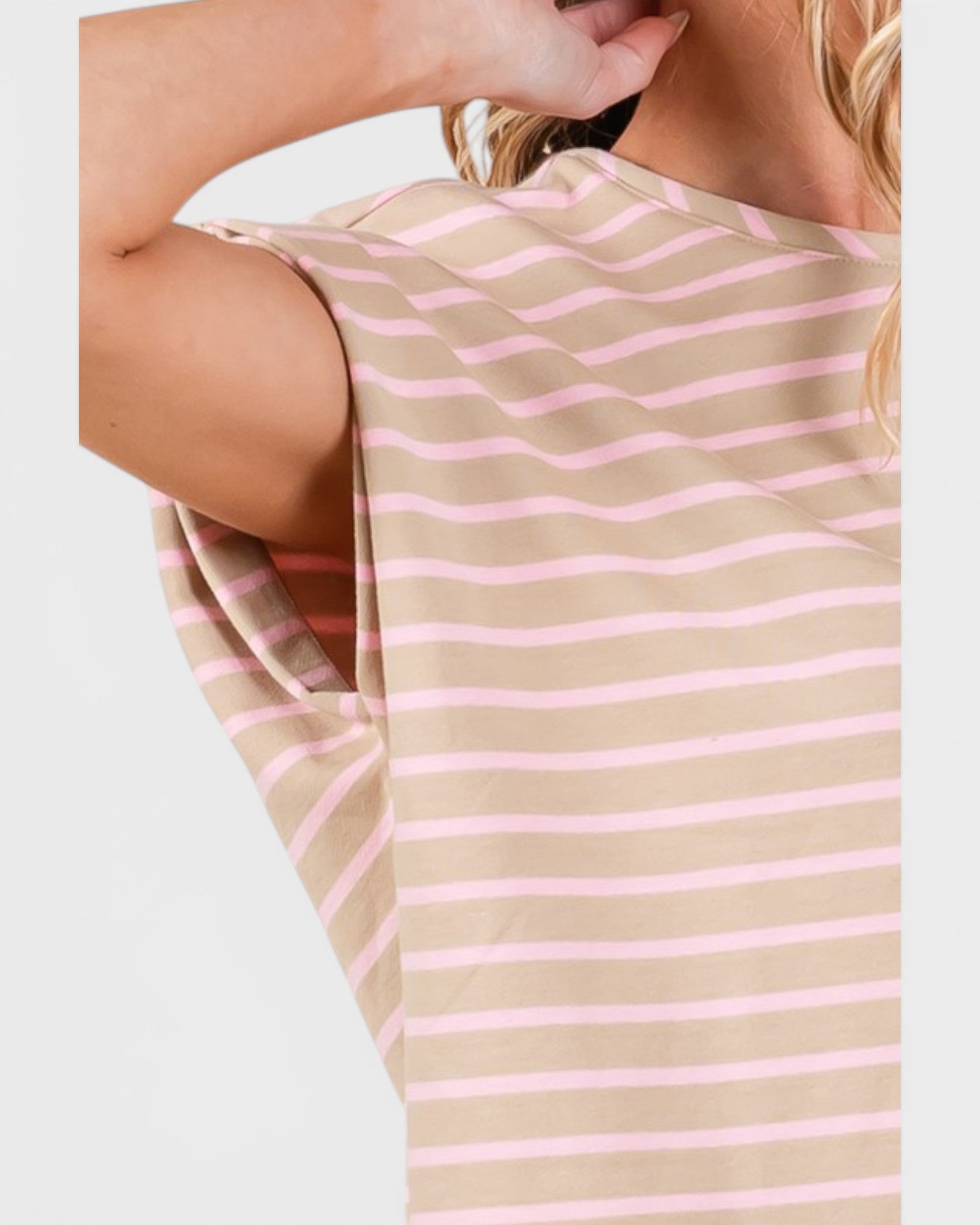 Beige and pink striped sleeveless top on a plain background