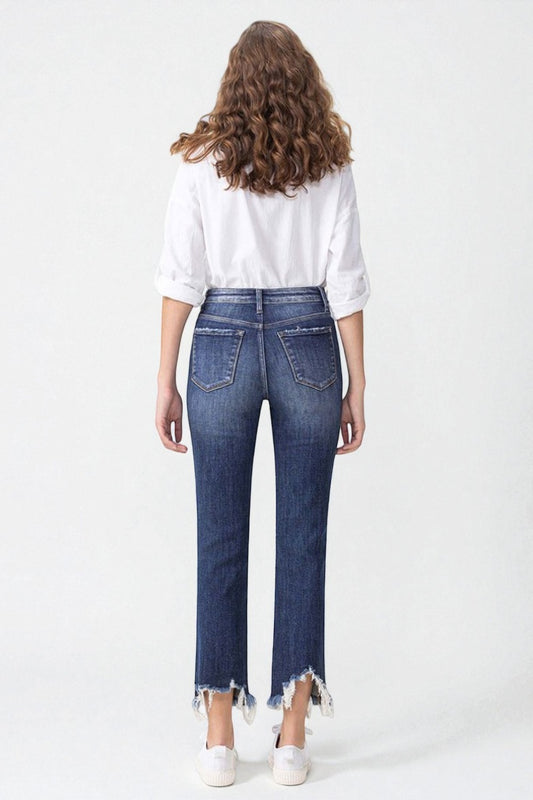 Person wearing blue jeans and a white shirt on a white background