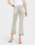 Light gray jeans worn by a person on a white background
