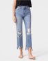 Person wearing light blue distressed jeans on a white background