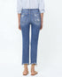 Person wearing blue jeans with a white background