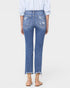 Person wearing blue jeans on a white background