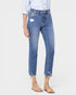 Blue jeans worn by a person on a white background