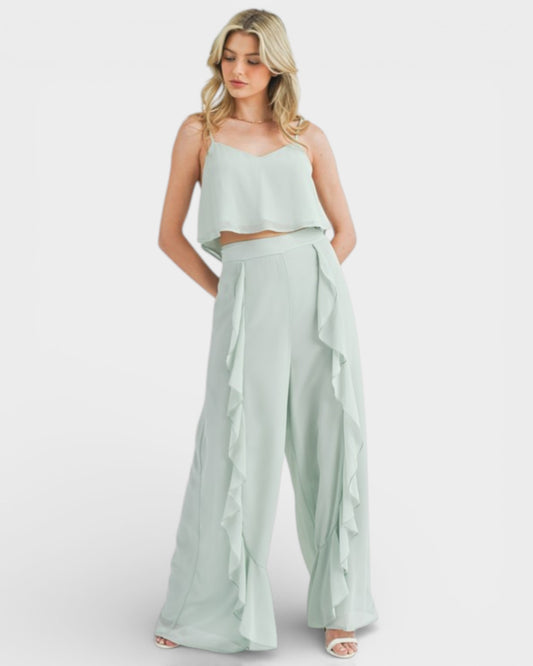 Woman wearing a light green outfit on a white background