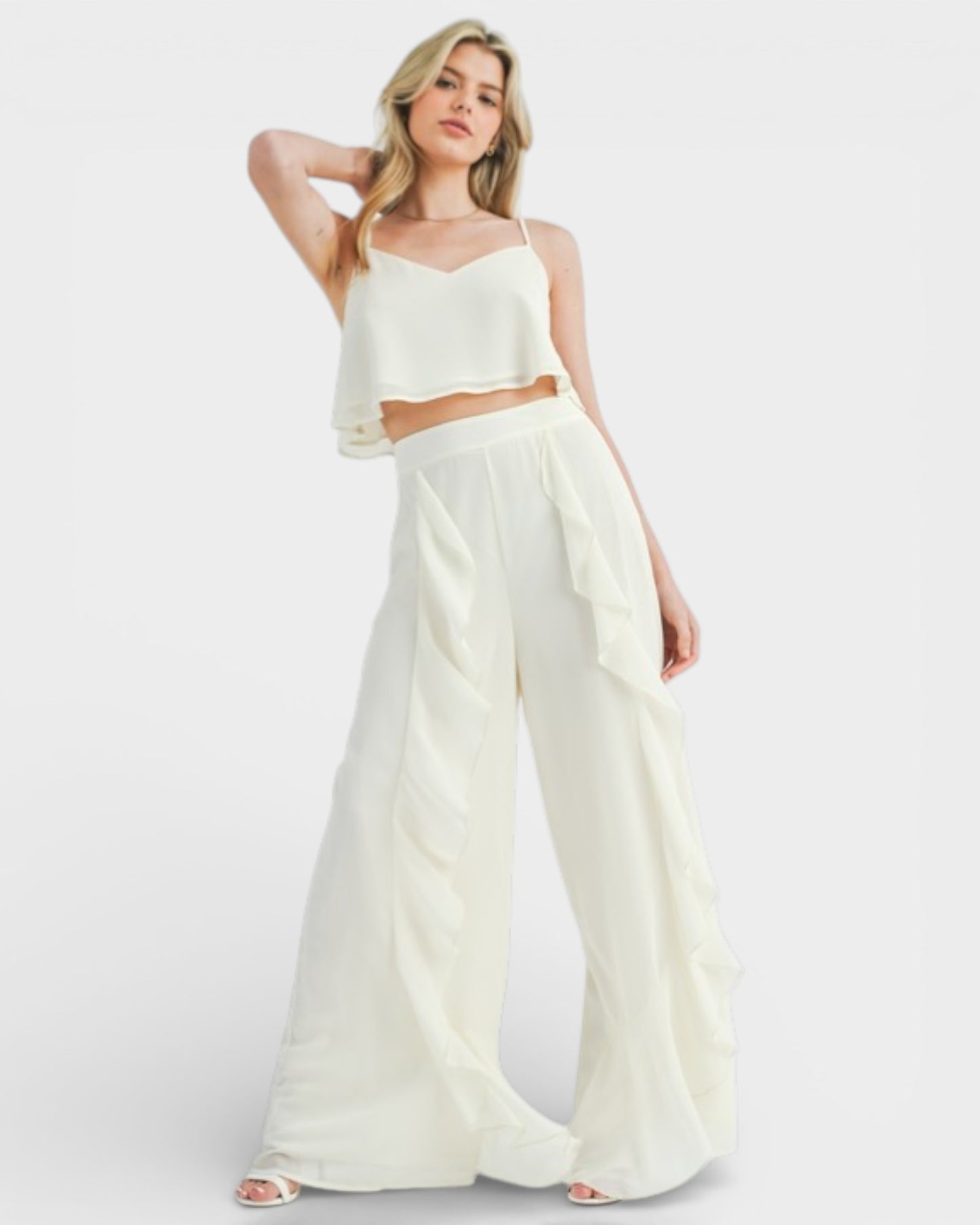 Woman wearing a white outfit on a white background