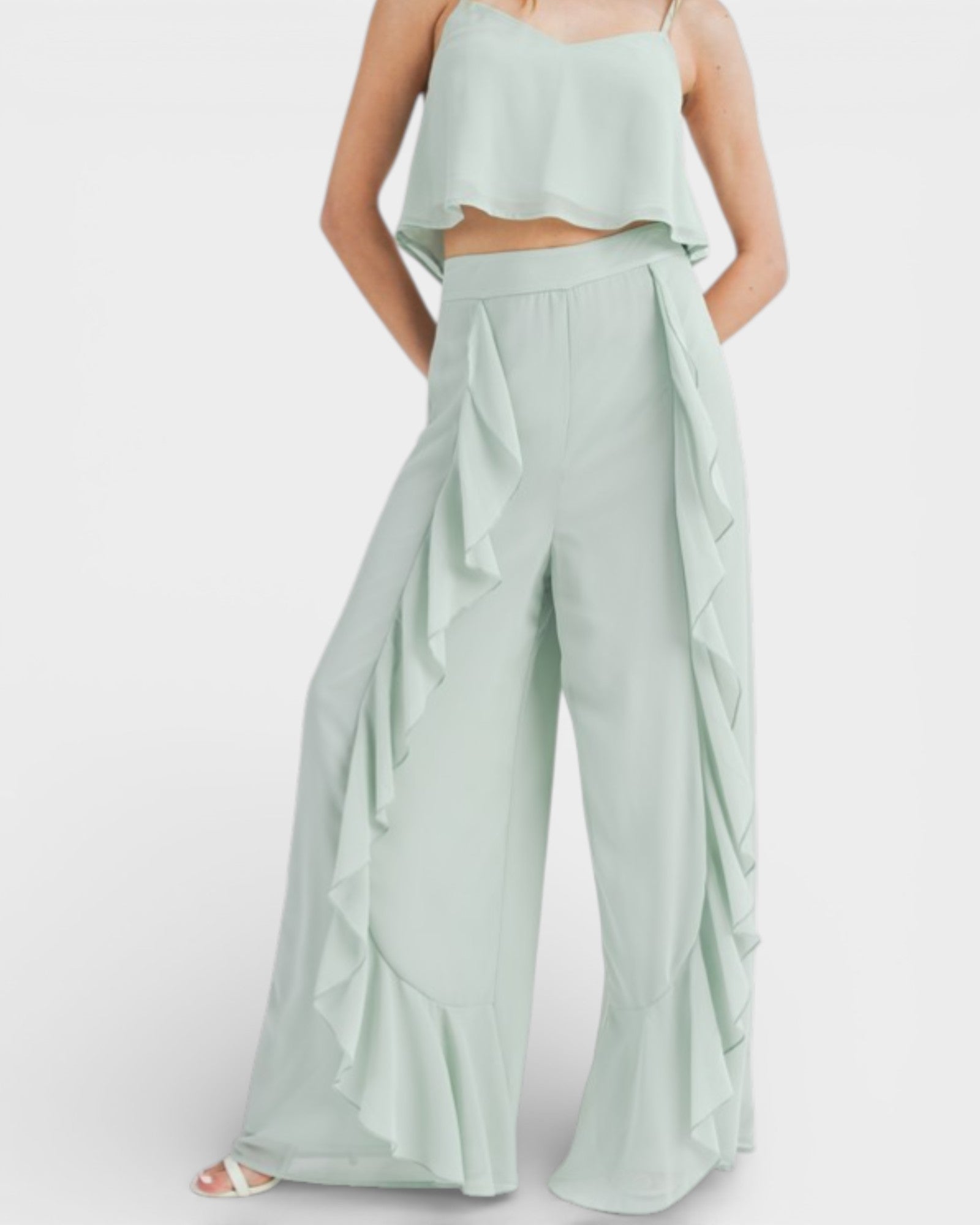 Light green outfit with a top and wide-leg pants on a white background