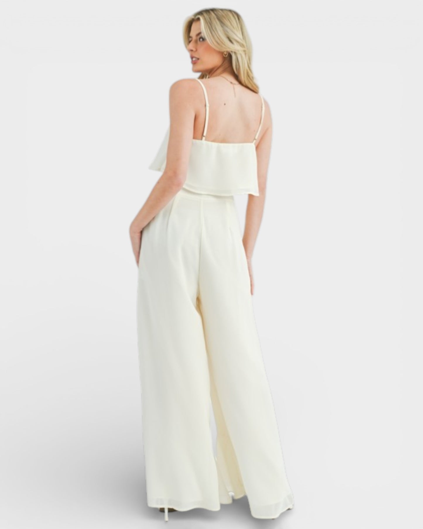 Woman wearing a white dress on a white background