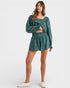 Woman wearing a green outfit on a white background