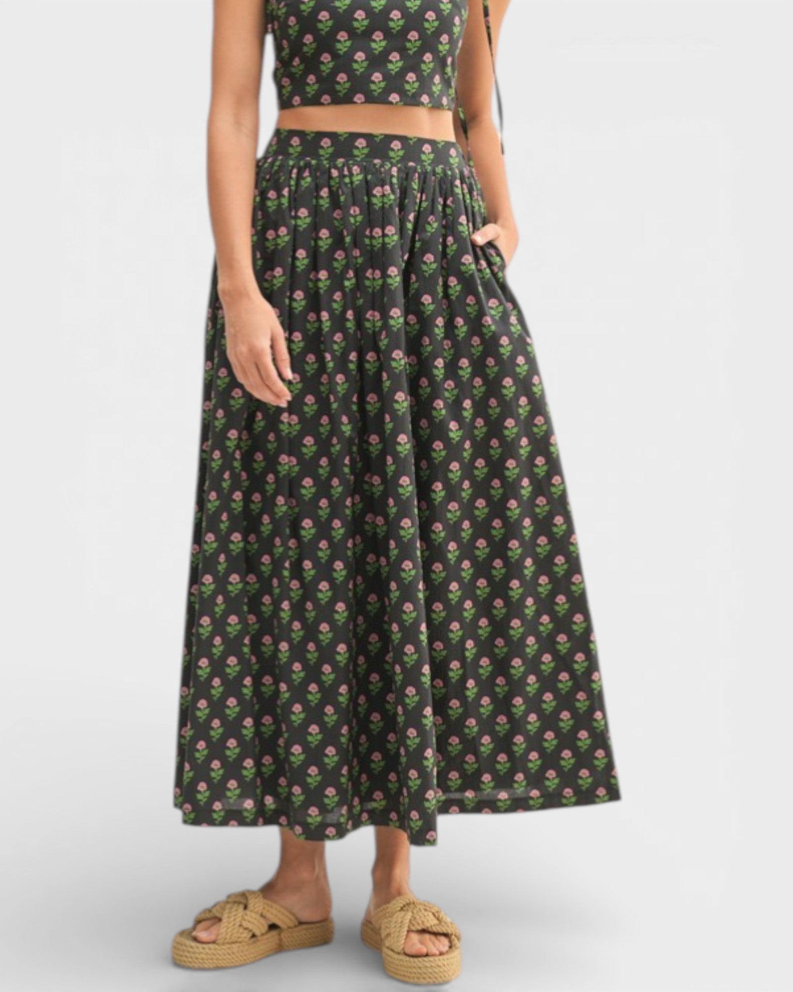 Woman wearing a floral dress with a white background