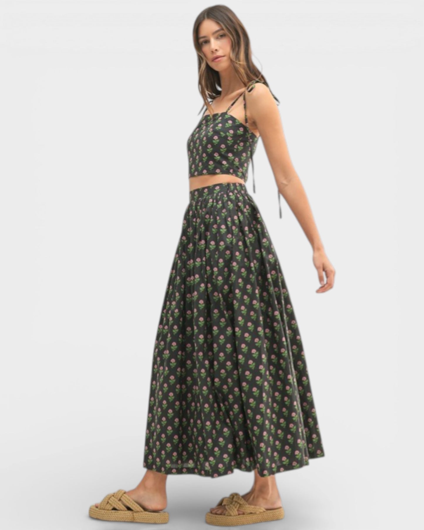 Woman wearing a floral dress on a white background