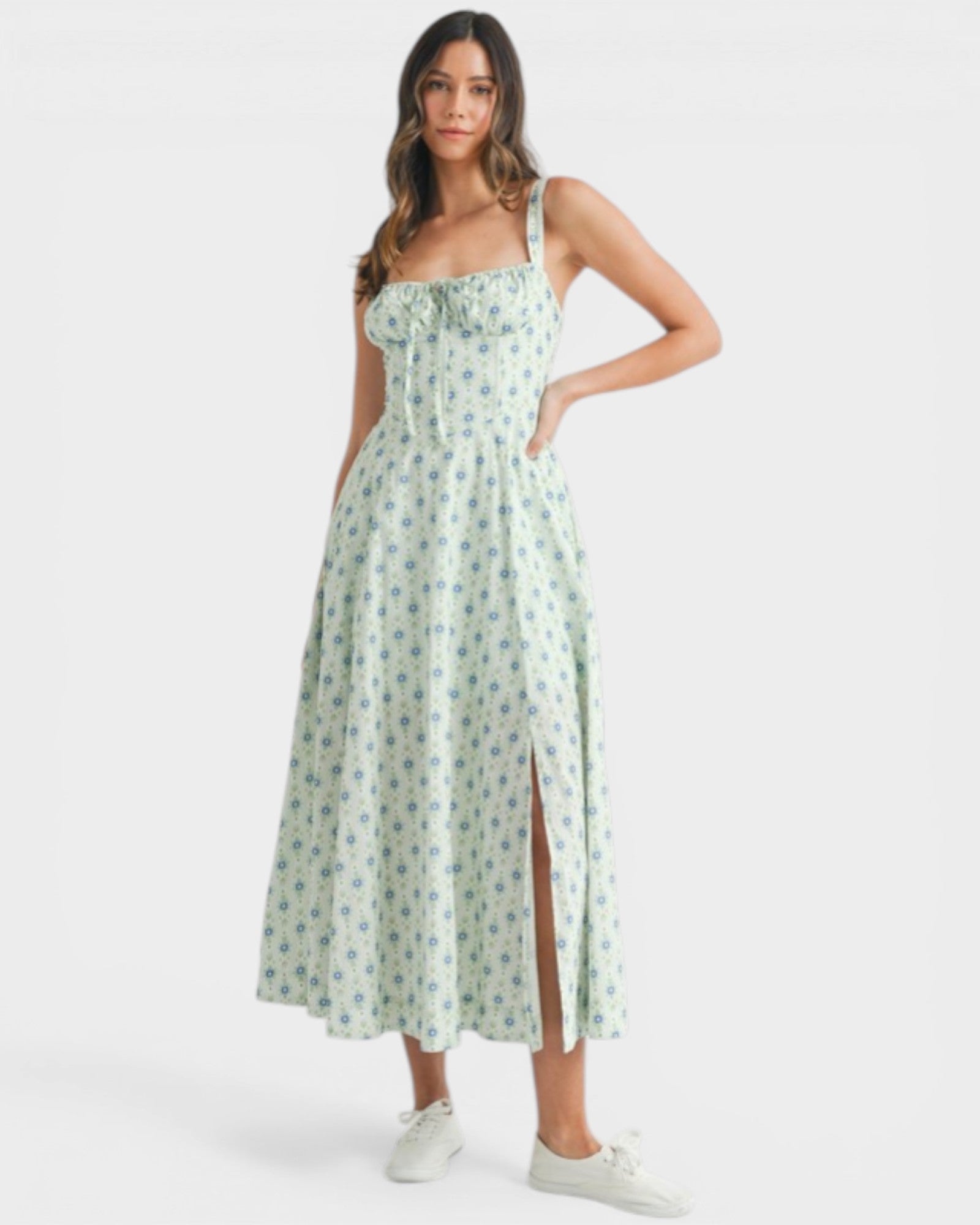 Woman wearing a floral dress with a white background