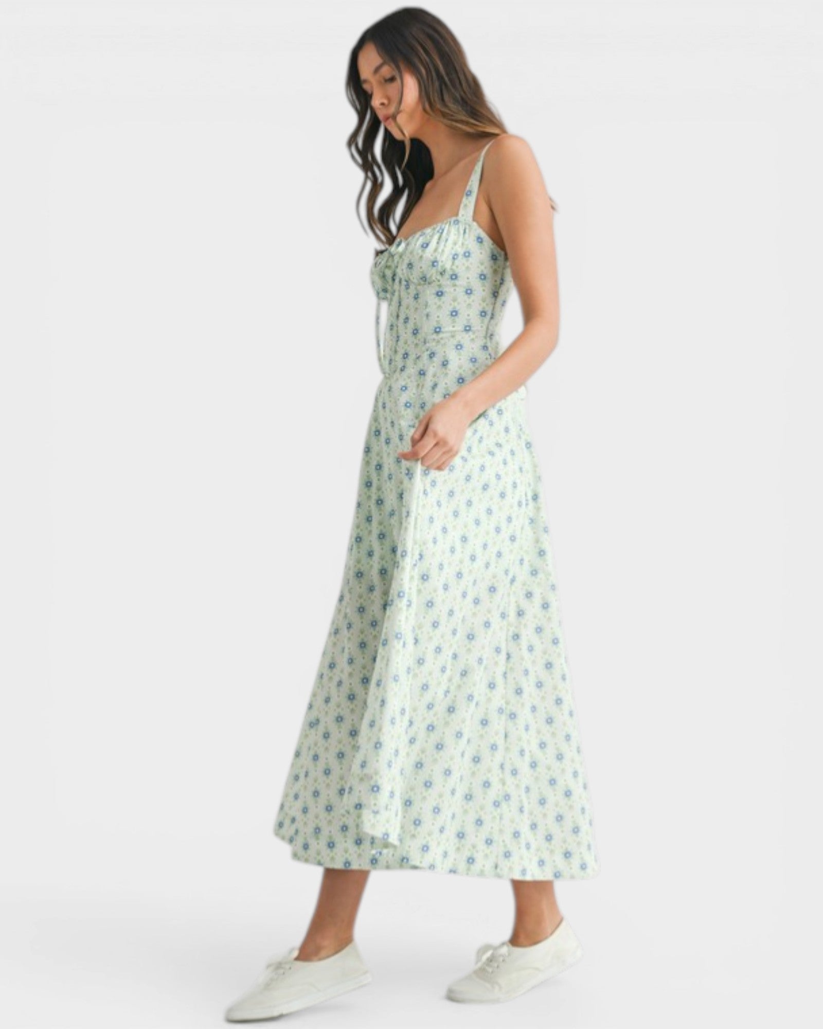 Woman wearing a floral dress on a white background