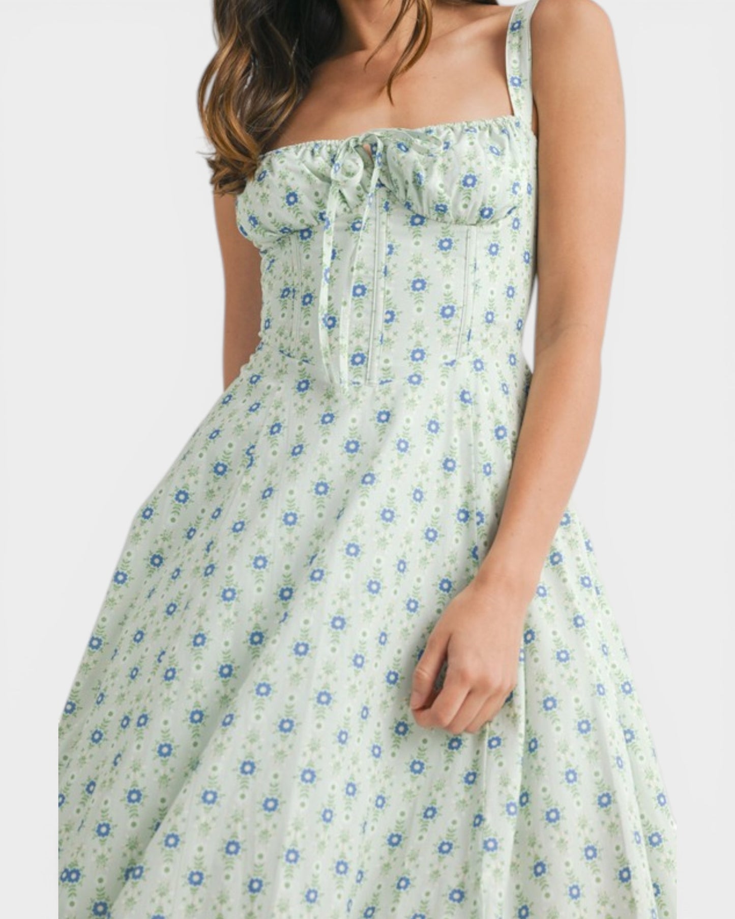 Woman wearing a floral dress with a white background