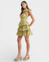 Woman wearing a yellow floral dress on a white background