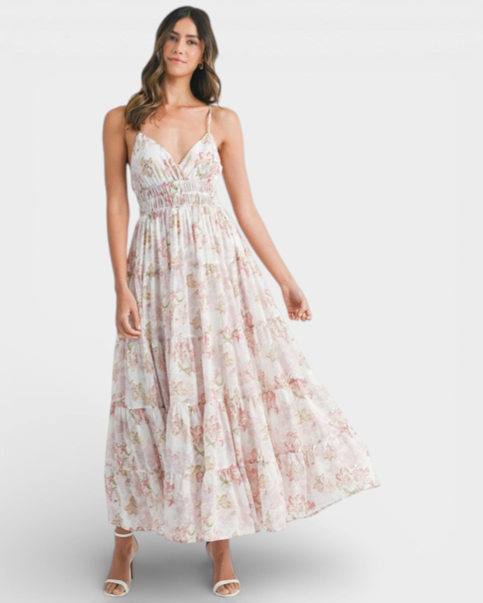 Woman wearing a floral dress on a white background