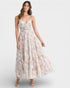 Woman wearing a floral dress on a white background
