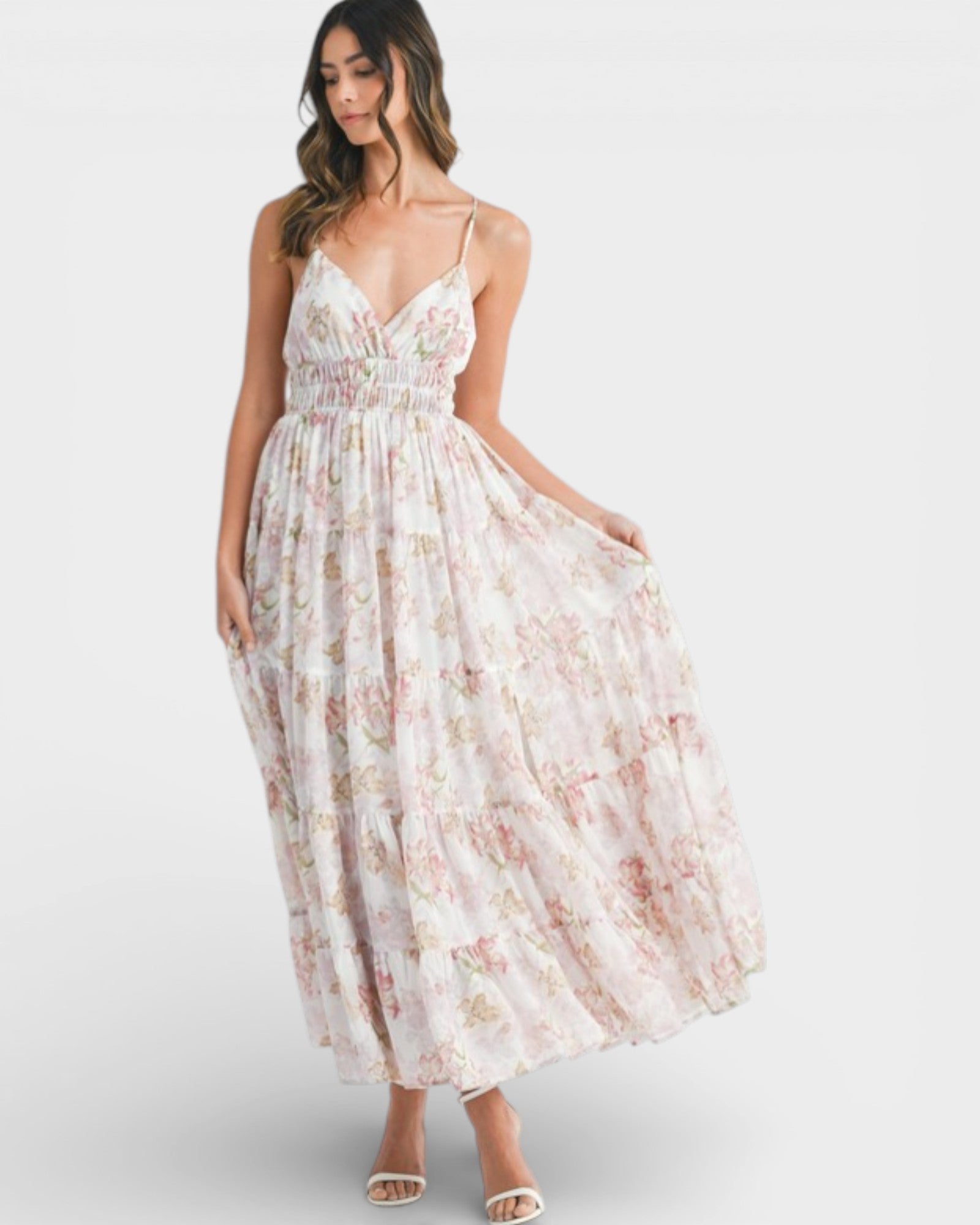 Woman wearing a floral dress on a white background