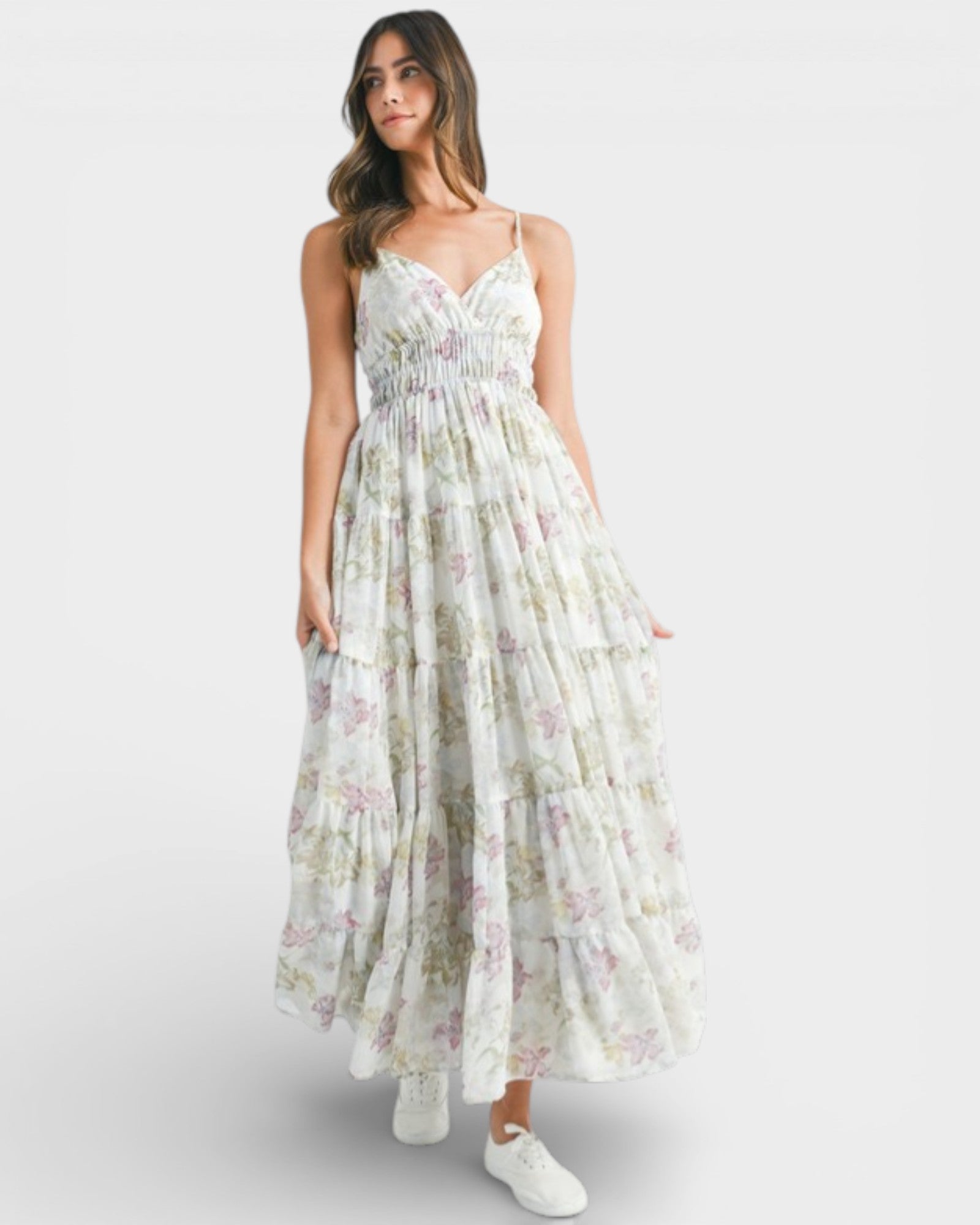 Woman wearing a floral dress on a white background