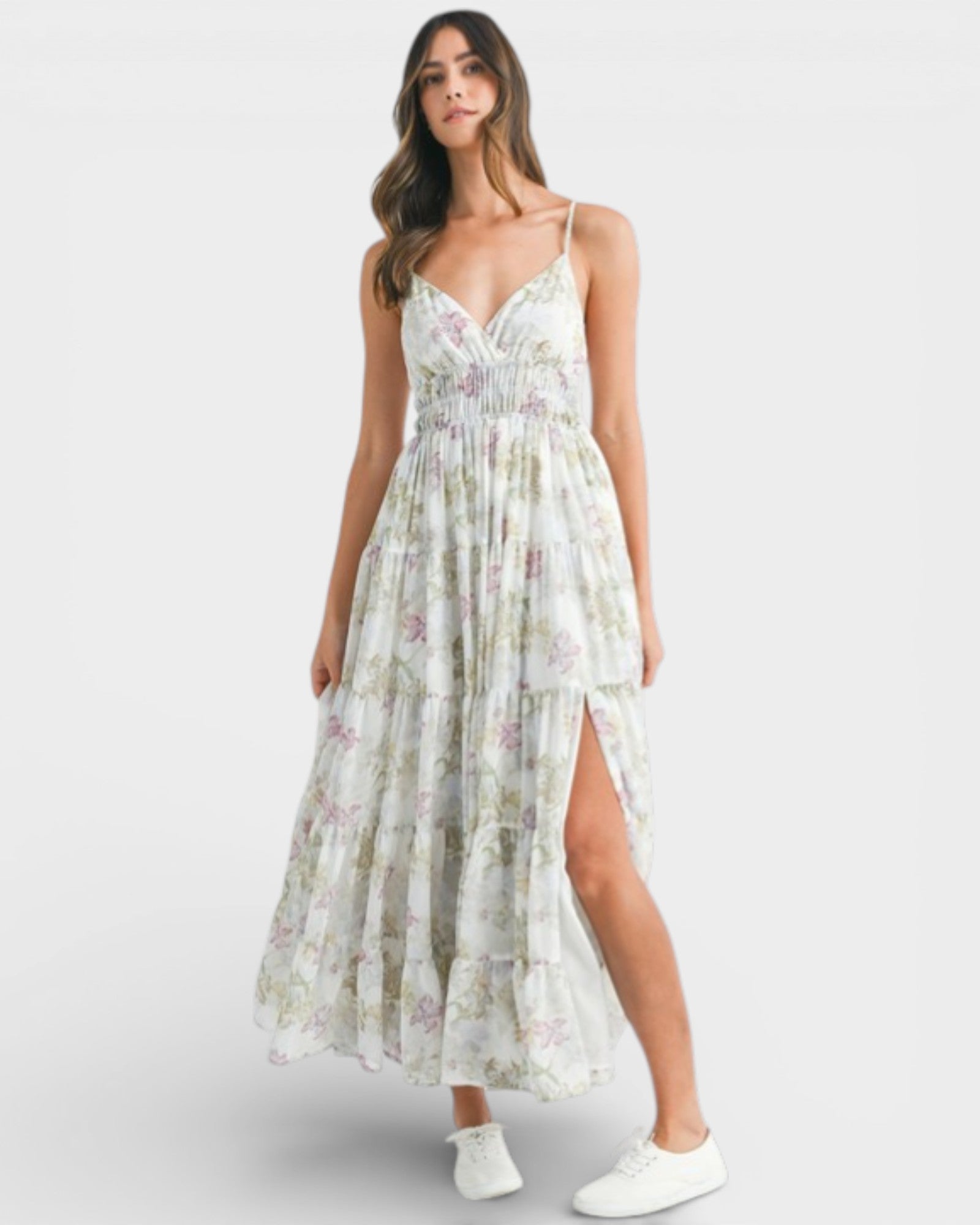 Woman wearing a floral dress with a white background